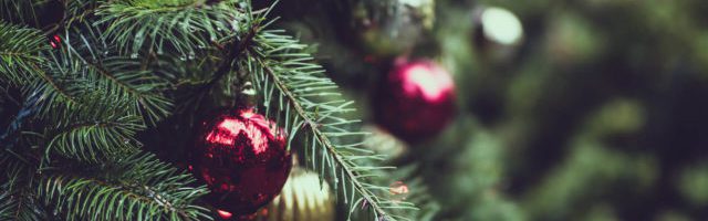 red and gold ornaments on a christmas tree