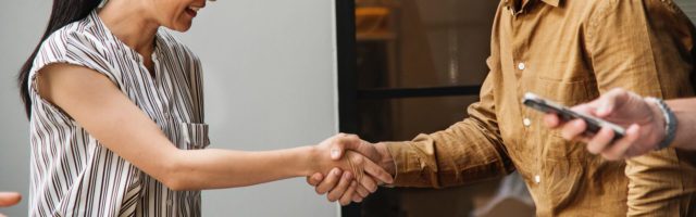 man and woman shaking hands