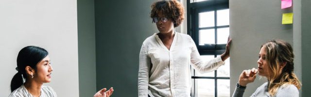 three business woman talking at a sales training course