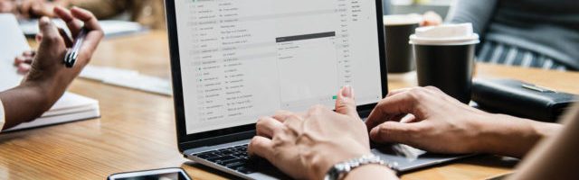 woman typing on computer