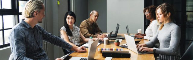 team on computers during sales training program