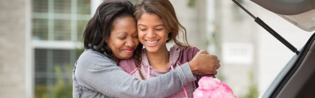 mother hugging her daughter